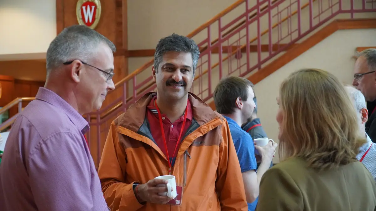 Attendees chatting at HTC24
