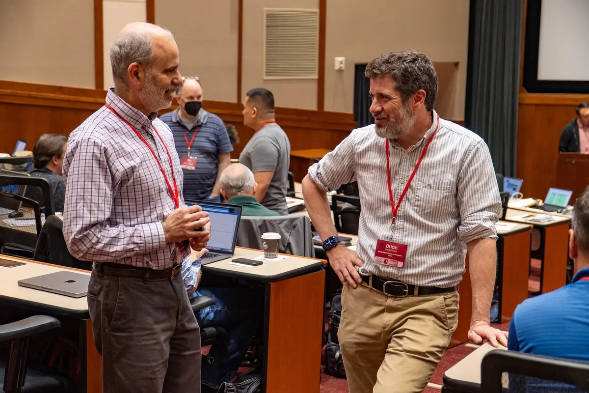 Two CHTC staff members in conversation