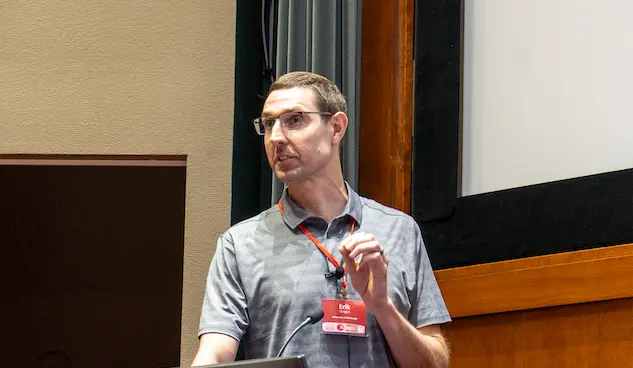 Erik Wright presenting his HTC25 Keynote Presenation.