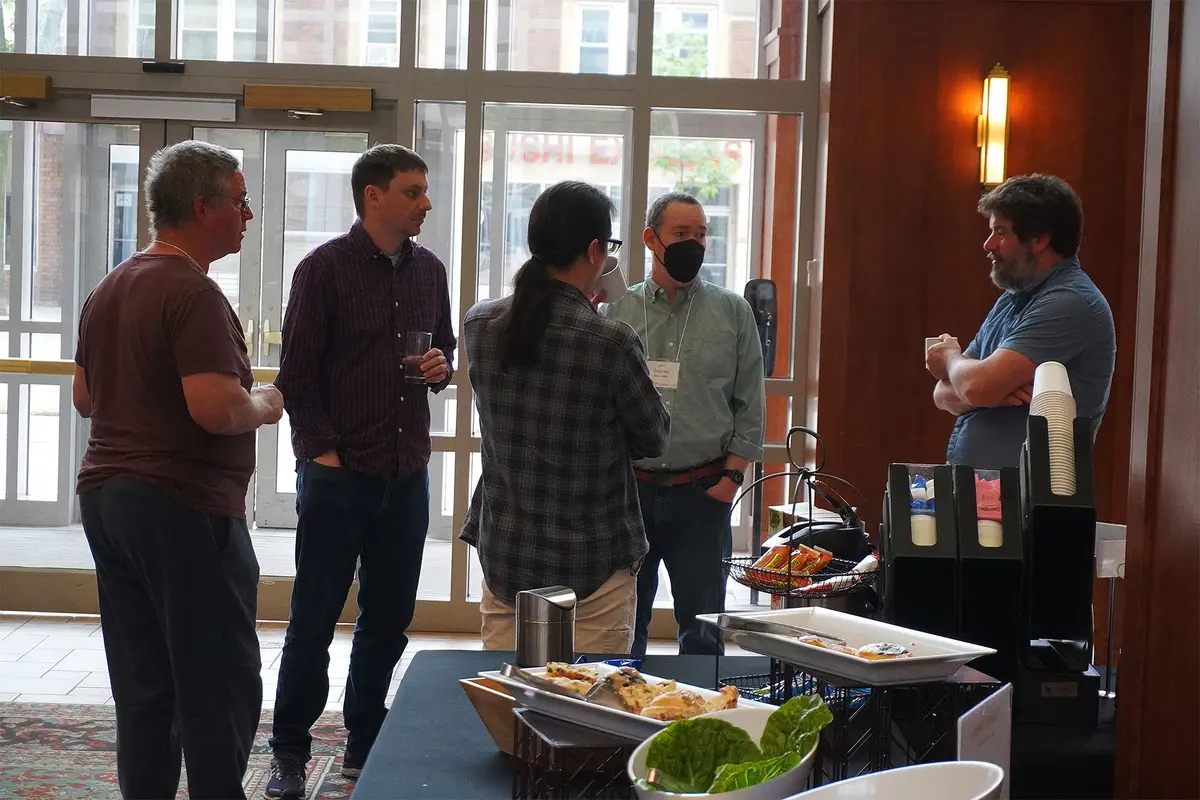 HTCondor Week attendees talking in the Fluno lobby