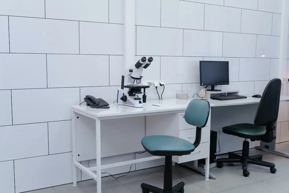 Microscope beside computer by Tima Miroshnichenko from Pexels.